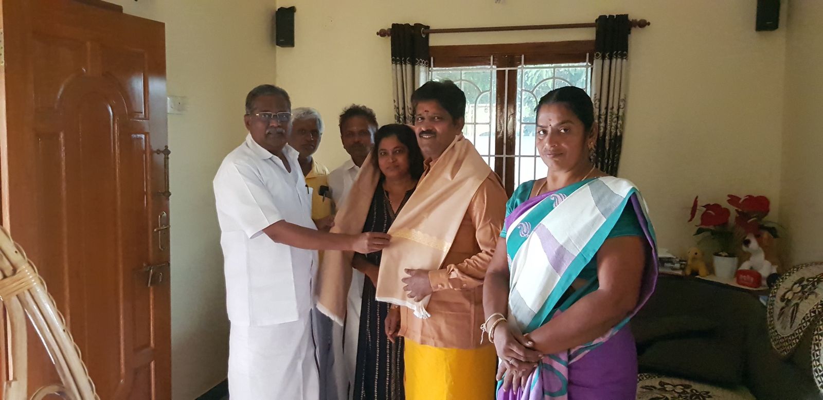 Honoured with a shawl at home
