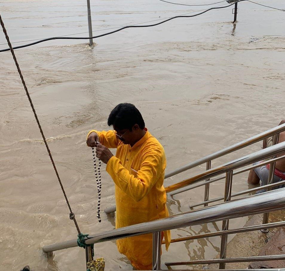 Guruji performing a ritual at the river